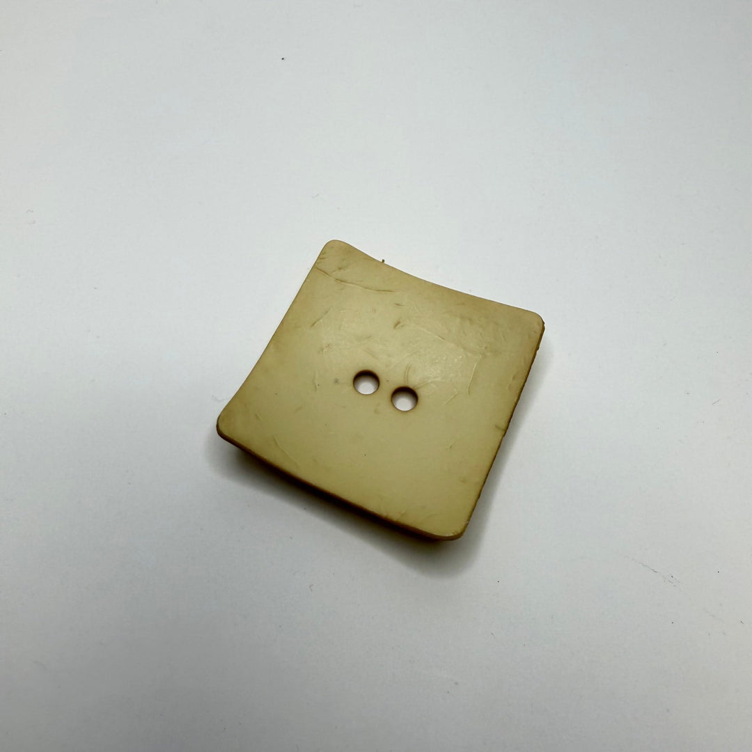 2 Hole Button - 45MM Plastic - Dark Cream - True Deadstock supplies Fabric by private - Sustainable Textile | FABCYCLE