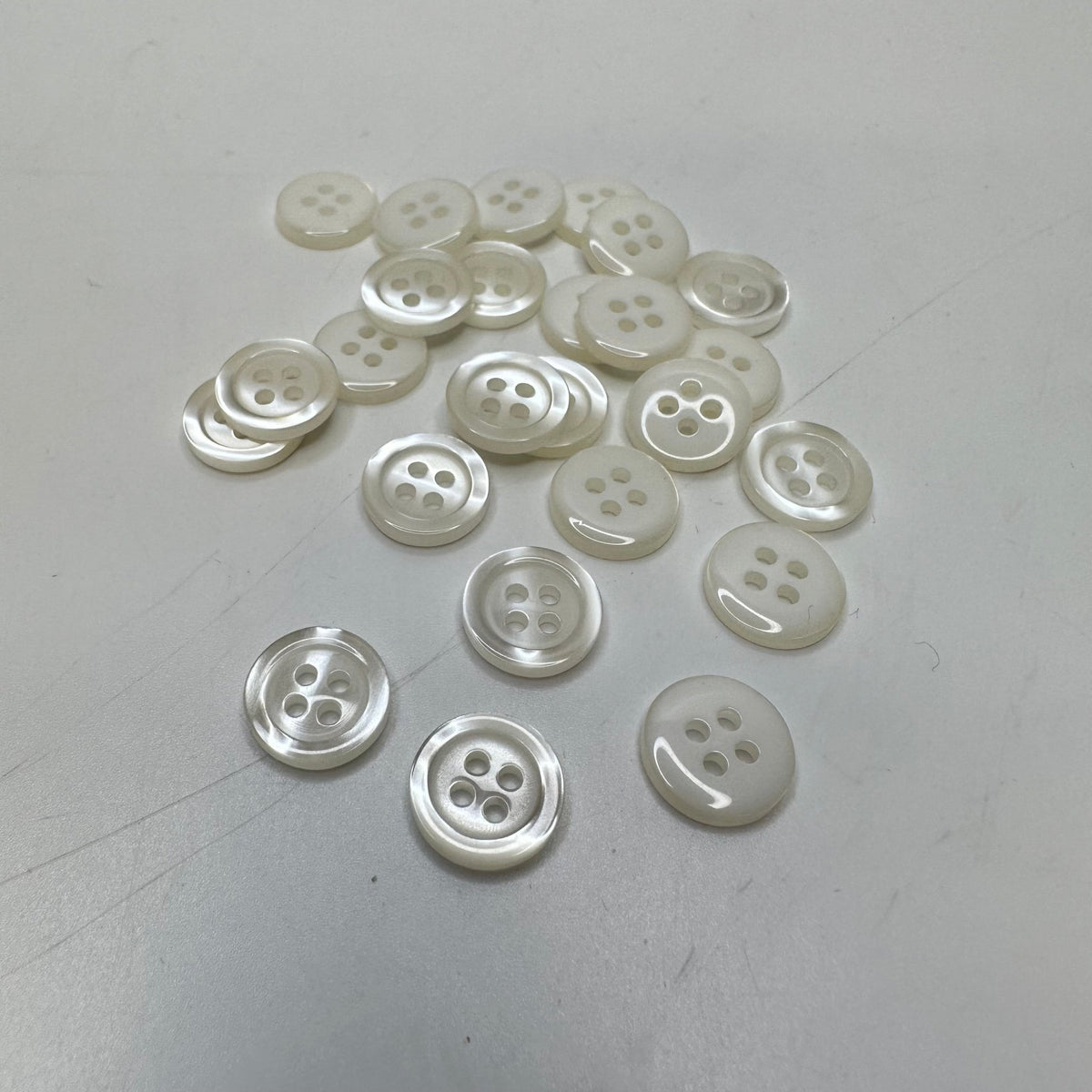 4 Hole Button - 10MM Plastic - Cream - 15 Pack - True Deadstock supplies Fabric by private - Sustainable Textile | FABCYCLE