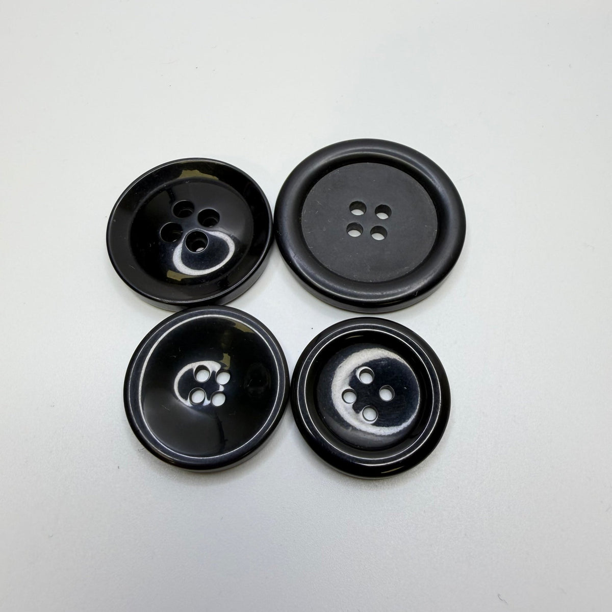 4 Hole Button - Plastic - Black - 4 Pack - True Deadstock supplies Fabric by private - Sustainable Textile | FABCYCLE