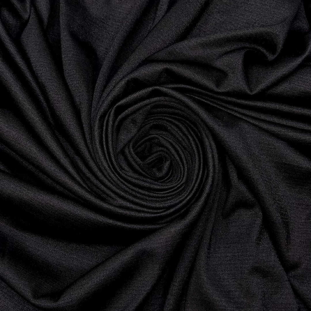 All I Want Is A Serger - Polyester Blend Knit - Black - 1.95M Bundle - True Deadstock fabric Fabric by private - Sustainable Textile | FABCYCLE