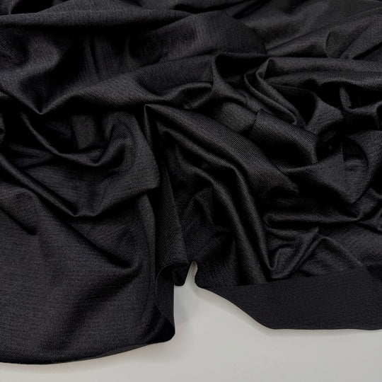 All I Want Is A Serger - Polyester Blend Knit - Black - 1.95M Bundle - True Deadstock fabric Fabric by private - Sustainable Textile | FABCYCLE