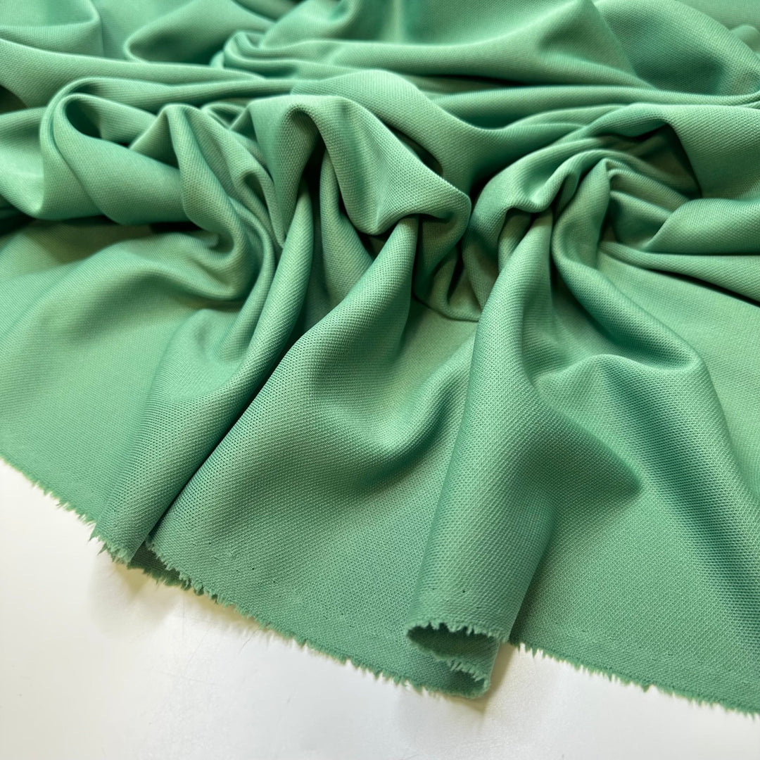 All The Green Flags - Jersey Poly/Acrylic Knit - Light Green - 2.4M Bundle - True Deadstock fabric Fabric by private - Sustainable Textile | FABCYCLE
