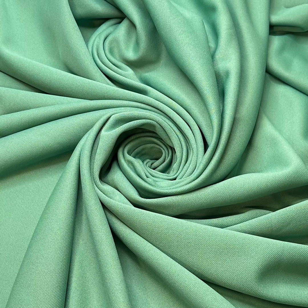All The Green Flags - Jersey Poly/Acrylic Knit - Light Green - 2.4M Bundle - True Deadstock fabric Fabric by private - Sustainable Textile | FABCYCLE