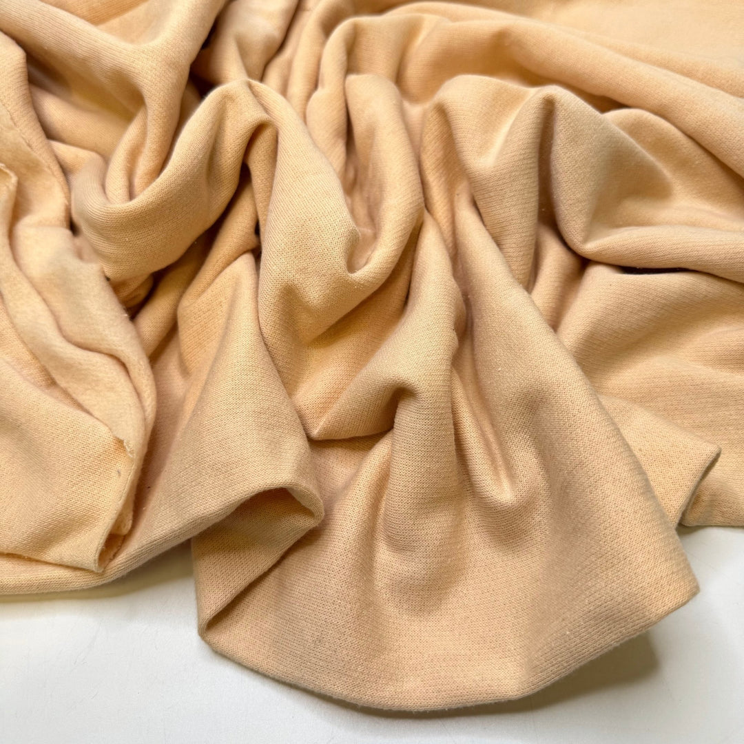 Butterflies In Your Stomach - Tubular Jersey Fleece Polyester Blend Knit - Light Beige - 1.1M Bundle - True Deadstock fabric Fabric by private - Sustainable Textile | FABCYCLE