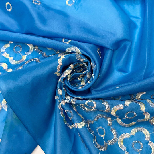 Growing New Petals - Embroidered Metallic Thread Polyester Blend Woven - Light Silver/Blue Floral Border - 4M Bundle - True Deadstock fabric Fabric by private - Sustainable Textile | FABCYCLE
