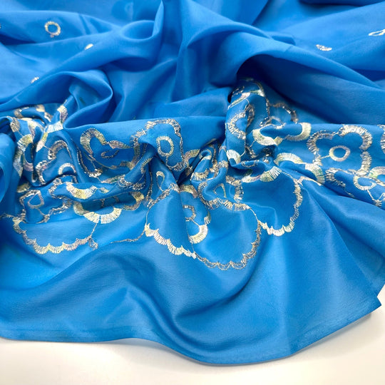 Growing New Petals - Embroidered Metallic Thread Polyester Blend Woven - Light Silver/Blue Floral Border - 4M Bundle - True Deadstock fabric Fabric by private - Sustainable Textile | FABCYCLE