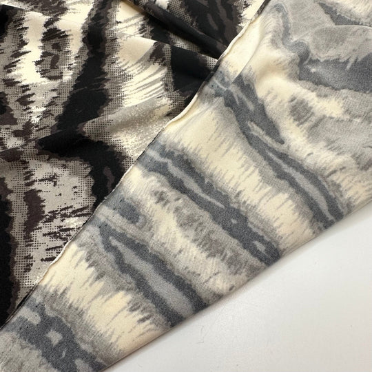 Heated Vibrations - Jersey Poly Knit - White/Black Animal Print - 1.25M Bundle - True Deadstock fabric Fabric by private - Sustainable Textile | FABCYCLE