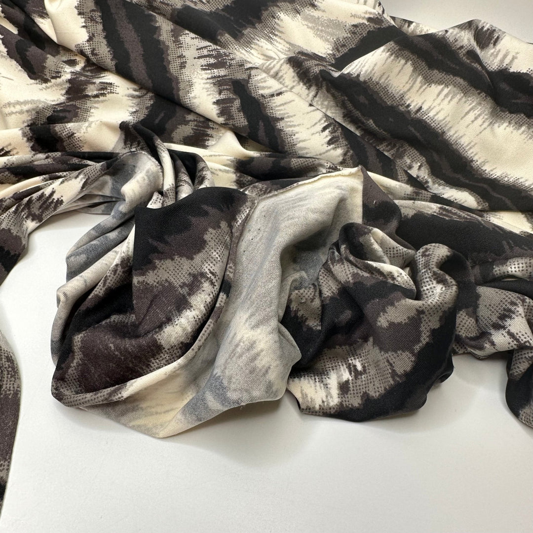 Heated Vibrations - Jersey Poly Knit - White/Black Animal Print - 1.25M Bundle - True Deadstock fabric Fabric by private - Sustainable Textile | FABCYCLE