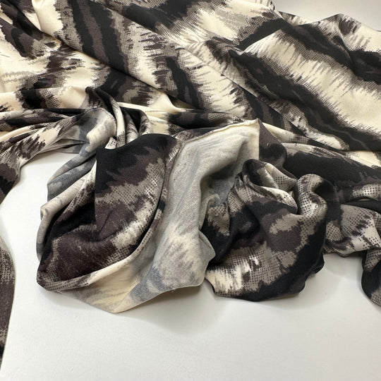 Heated Vibrations - Jersey Poly Knit - White/Black Animal Print - 1.25M Bundle - True Deadstock fabric Fabric by private - Sustainable Textile | FABCYCLE