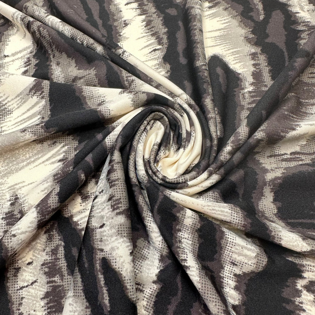 Heated Vibrations - Jersey Poly Knit - White/Black Animal Print - 1.25M Bundle - True Deadstock fabric Fabric by private - Sustainable Textile | FABCYCLE