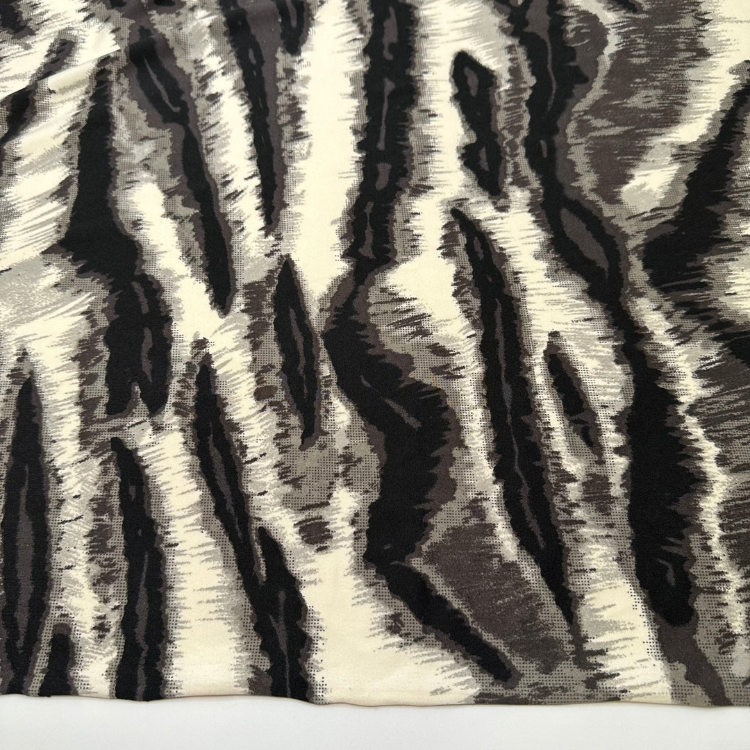 Heated Vibrations - Jersey Poly Knit - White/Black Animal Print - 1.25M Bundle - True Deadstock fabric Fabric by private - Sustainable Textile | FABCYCLE
