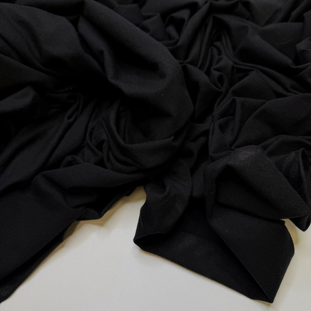 No Landfall Of Hurricanes - Jersey Cotton Knit - Black - 2.5M Bundle - True Deadstock fabric Fabric by private - Sustainable Textile | FABCYCLE