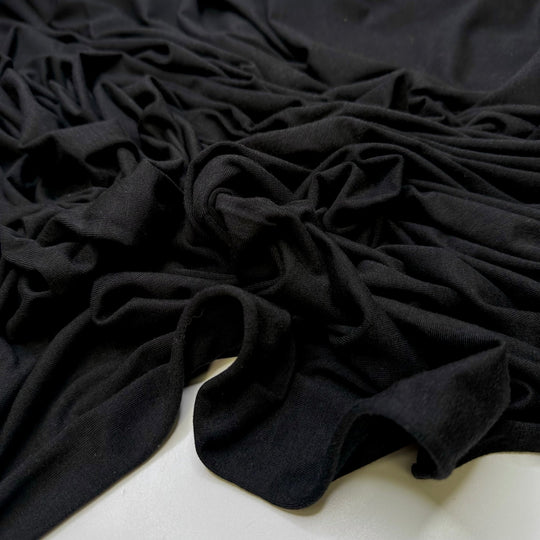 Picking Up Litter - Jersey Natural Blend Knit - Black - 1M Bundle - True Deadstock fabric Fabric by private - Sustainable Textile | FABCYCLE
