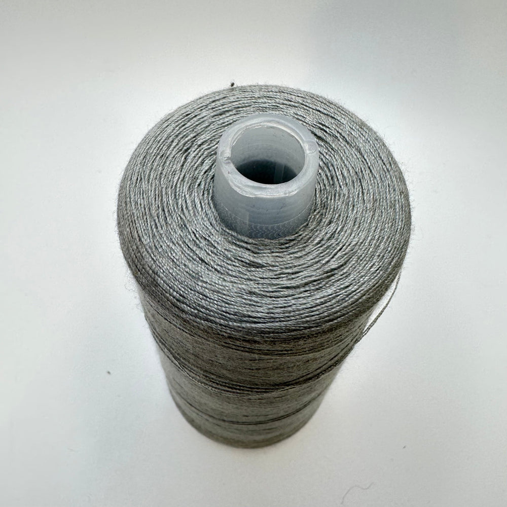 Poly/Cotton Blend Topstitch Thread - Light Grey - True Deadstock supplies Fabric by private - Sustainable Textile | FABCYCLE