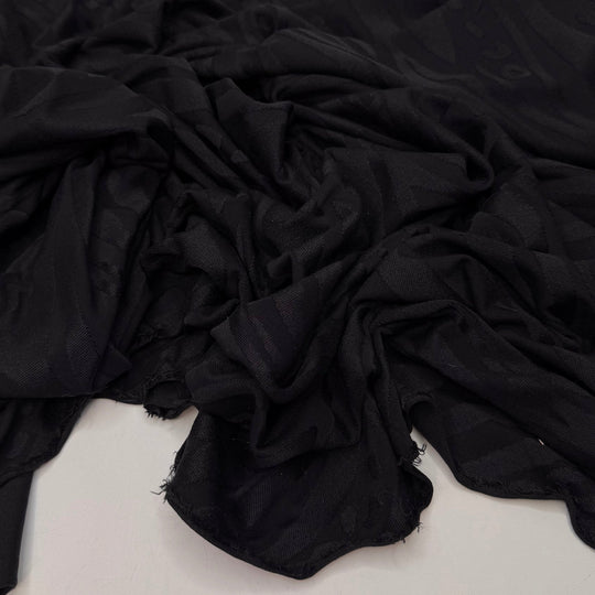 Pool Party Animal - Jersey Poly/Spandex Knit - Black Animal Print - 1.05M Bundle - True Deadstock fabric Fabric by private - Sustainable Textile | FABCYCLE