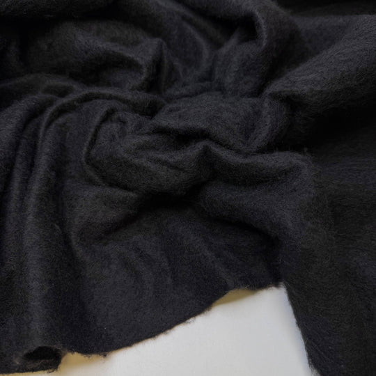 Raising Huskies - Felt Synthetic Woven - Black - 1.3M Bundle - True Deadstock fabric Fabric by private - Sustainable Textile | FABCYCLE