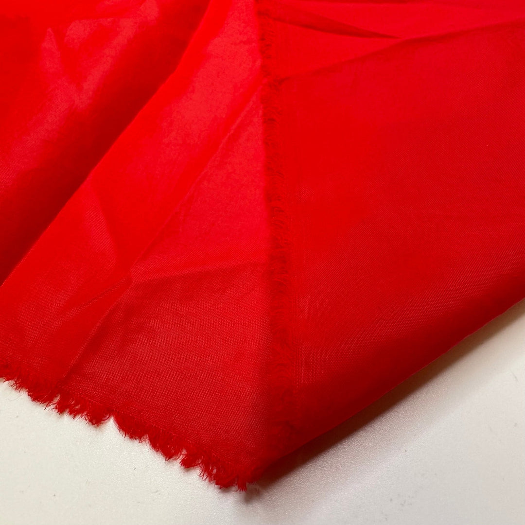 Santa Forgot His Raincoat - Water Resistant Polyester Blend Woven - Red - 1.6M Bundle - True Deadstock fabric Fabric by private - Sustainable Textile | FABCYCLE