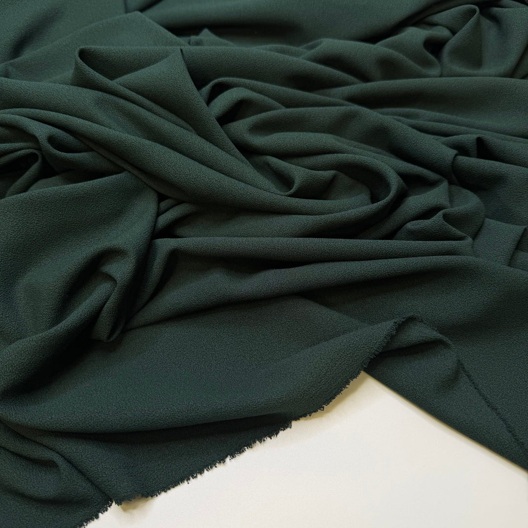 Setting Up The Christmas Tree - Crepe Poly Woven - Dark Green - 2M Bundle - True Deadstock fabric Fabric by private - Sustainable Textile | FABCYCLE
