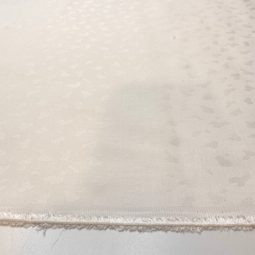 Snow Leopard In Hiding - Polyester Blend Woven - White Animal Print - Bundles - True Deadstock fabric Fabric by private - Sustainable Textile | FABCYCLE