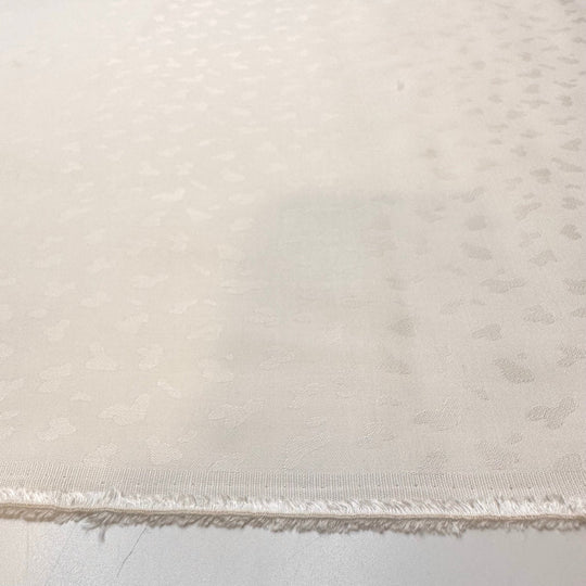Snow Leopard In Hiding - Polyester Blend Woven - White Animal Print - Bundles - True Deadstock fabric Fabric by private - Sustainable Textile | FABCYCLE