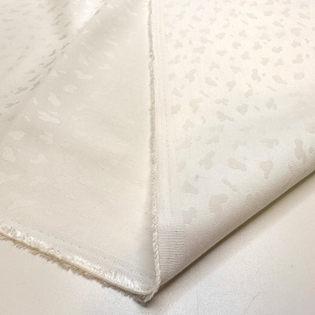Snow Leopard In Hiding - Polyester Blend Woven - White Animal Print - Bundles - True Deadstock fabric Fabric by private - Sustainable Textile | FABCYCLE