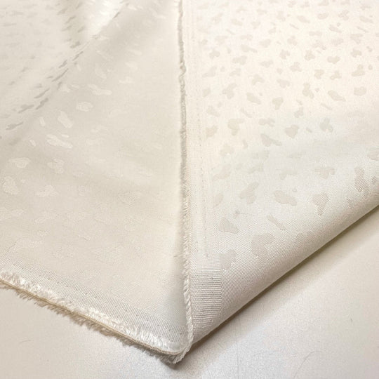 Snow Leopard In Hiding - Polyester Blend Woven - White Animal Print - Bundles - True Deadstock fabric Fabric by private - Sustainable Textile | FABCYCLE