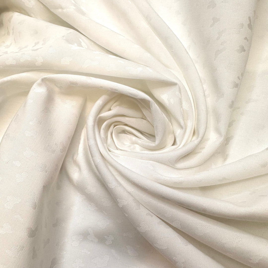 Snow Leopard In Hiding - Polyester Blend Woven - White Animal Print - Bundles - True Deadstock fabric Fabric by private - Sustainable Textile | FABCYCLE