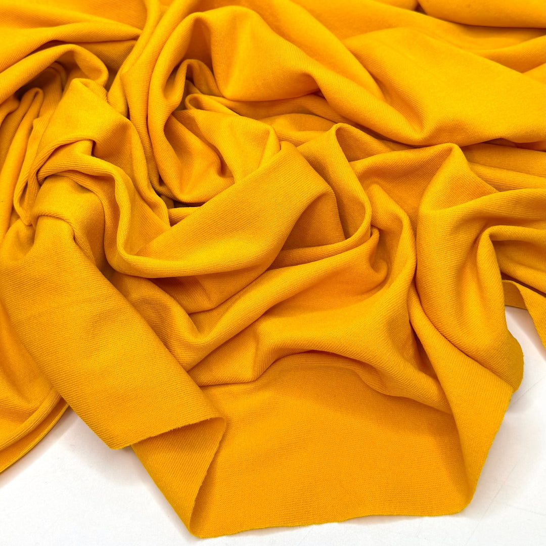 Sun Rays By The Pool - Rib Knit Polyester Blend Knit - Dark Yellow - 1M Bundle - True Deadstock fabric Fabric by private - Sustainable Textile | FABCYCLE