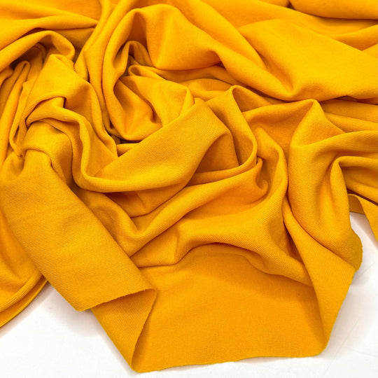 Sun Rays By The Pool - Rib Knit Polyester Blend Knit - Dark Yellow - 1M Bundle - True Deadstock fabric Fabric by private - Sustainable Textile | FABCYCLE