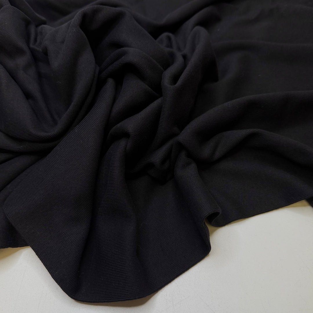 Taking Family Photos - Tubular Rib Knit Cotton Blend Knit - Black - 1.2M Bundle - True Deadstock fabric Fabric by private - Sustainable Textile | FABCYCLE