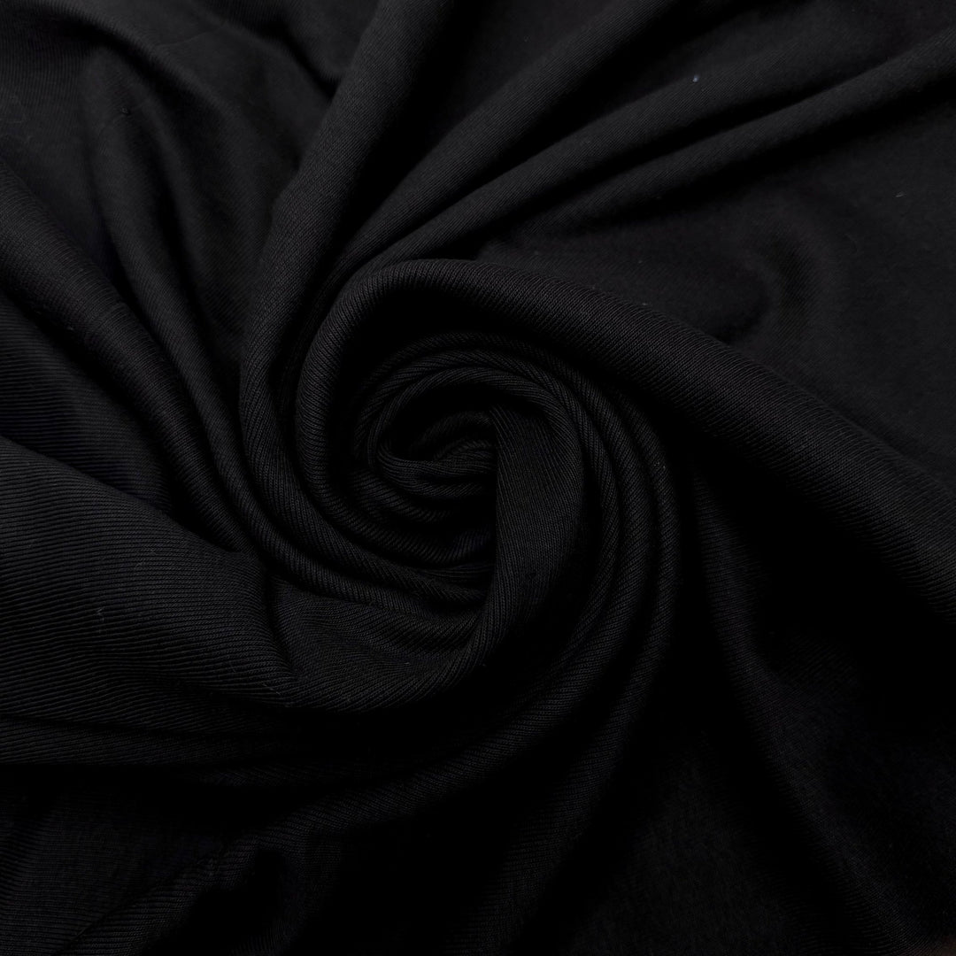 Taking Family Photos - Tubular Rib Knit Cotton Blend Knit - Black - 1.2M Bundle - True Deadstock fabric Fabric by private - Sustainable Textile | FABCYCLE