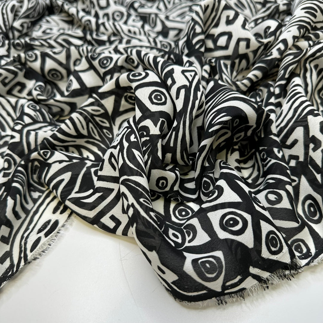 The Hills Have Eyes - Crepe Poly Woven - White/Black Abstract - Bundles - True Deadstock fabric Fabric by private - Sustainable Textile | FABCYCLE