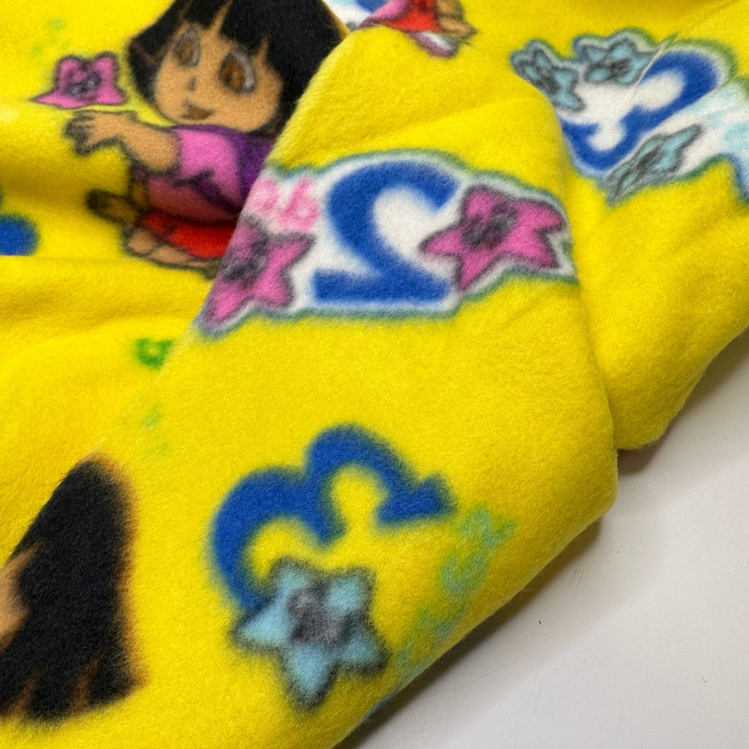 UB - A - Dora - Ble - Fleece Poly Knit - Yellow Multi Dora The Explorer - 1.5M Bundle - True Deadstock fabric Fabric by private - Sustainable Textile | FABCYCLE