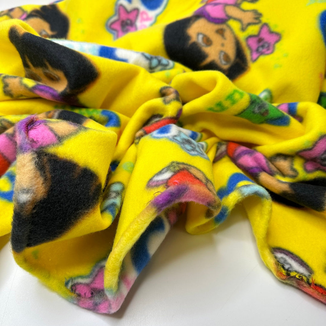 UB - A - Dora - Ble - Fleece Poly Knit - Yellow Multi Dora The Explorer - 1.5M Bundle - True Deadstock fabric Fabric by private - Sustainable Textile | FABCYCLE