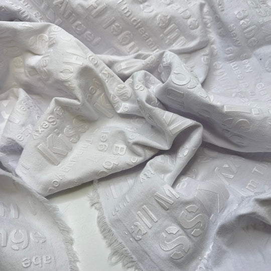 UB - Angel Babe Hottie - Pu Words Pressed On Denim Cotton/PU Woven - White Words - 1.95M Bundle - True Deadstock fabric Fabric by private - Sustainable Textile | FABCYCLE