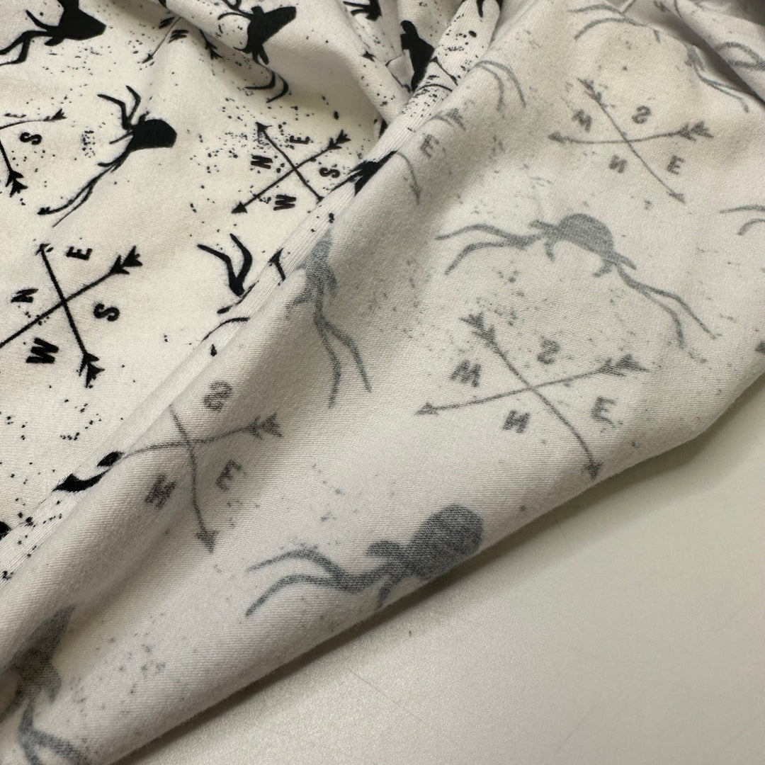 UB - Rudolph Leads The Way - Jersey Cotton Blend Knit - White/Black Reindeer Motif - 1M Bundle - True Deadstock fabric Fabric by private - Sustainable Textile | FABCYCLE
