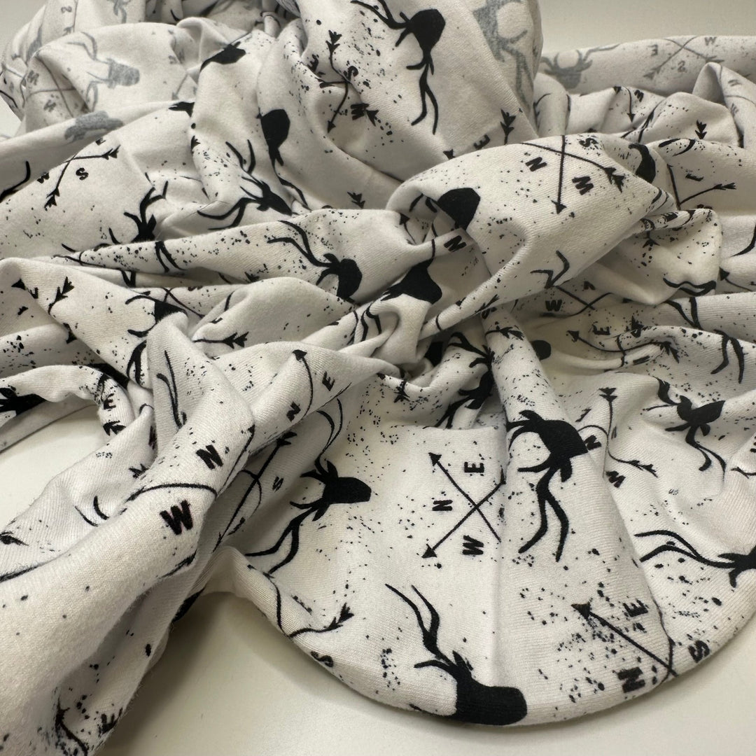 UB - Rudolph Leads The Way - Jersey Cotton Blend Knit - White/Black Reindeer Motif - 1M Bundle - True Deadstock fabric Fabric by private - Sustainable Textile | FABCYCLE