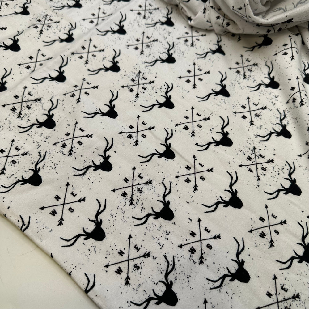 UB - Rudolph Leads The Way - Jersey Cotton Blend Knit - White/Black Reindeer Motif - 1M Bundle - True Deadstock fabric Fabric by private - Sustainable Textile | FABCYCLE