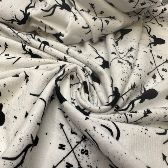 UB - Rudolph Leads The Way - Jersey Cotton Blend Knit - White/Black Reindeer Motif - 1M Bundle - True Deadstock fabric Fabric by private - Sustainable Textile | FABCYCLE
