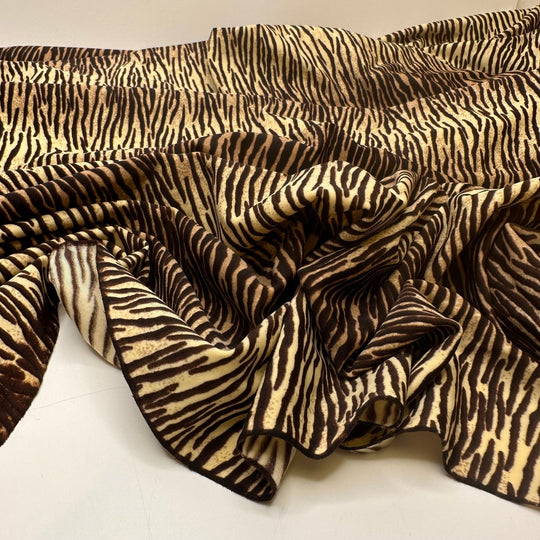 UB - Tigress - Water Resistant Jersey Poly/Spandex Knit - Cream/Brown Animal Print - 3.3M Bundle - True Deadstock fabric Fabric by private - Sustainable Textile | FABCYCLE
