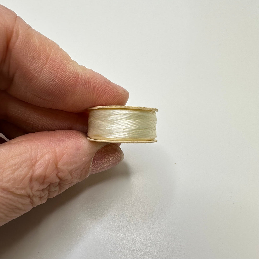 Wax Nylon Thread On Paper Bobbin Tools - Cream/White - Individual - True Deadstock supplies Fabric by private - Sustainable Textile | FABCYCLE