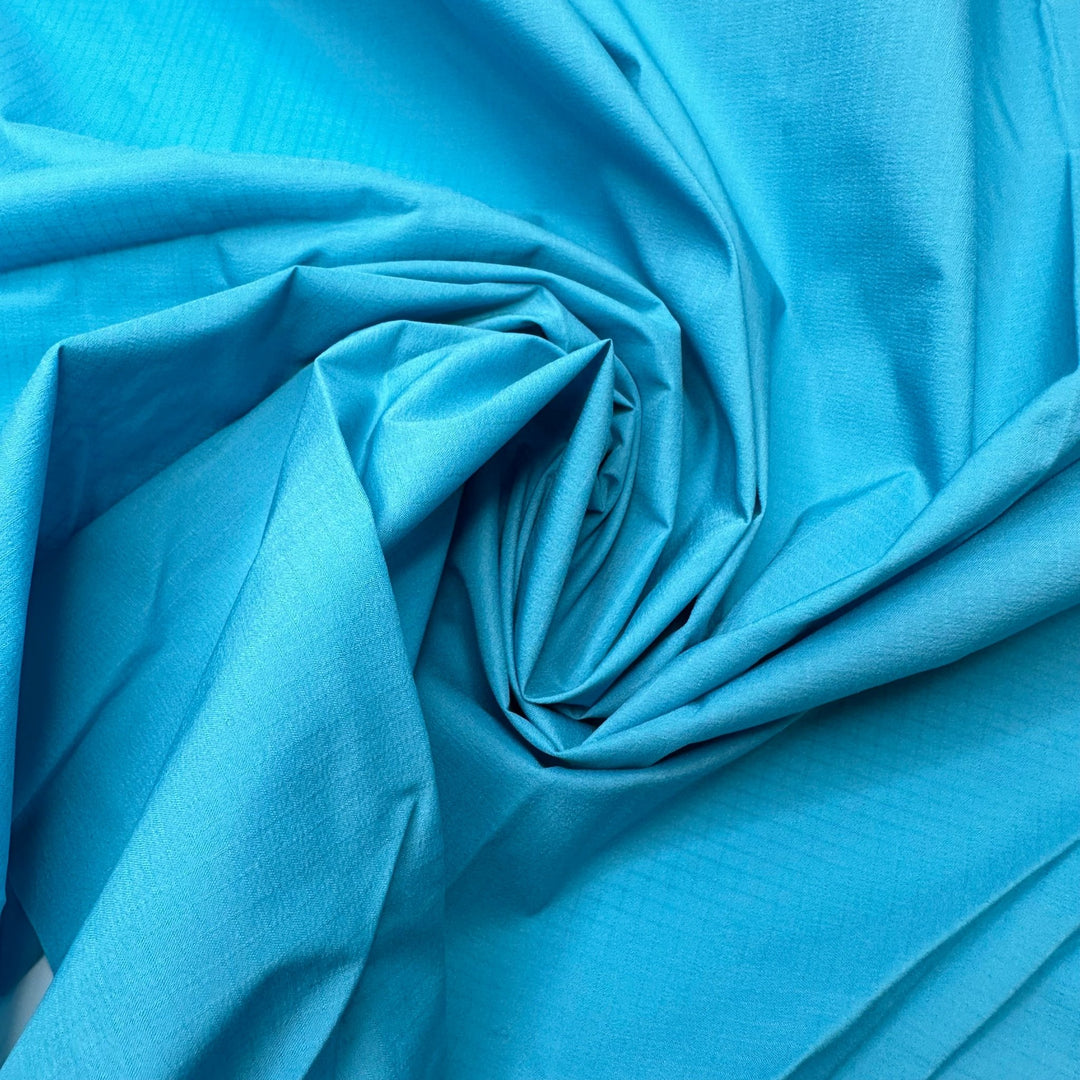 With A Perfect Flourish - Ripstop Nylon Woven - Light Blue - 1.5M Bundle - True Deadstock fabric Fabric by private - Sustainable Textile | FABCYCLE