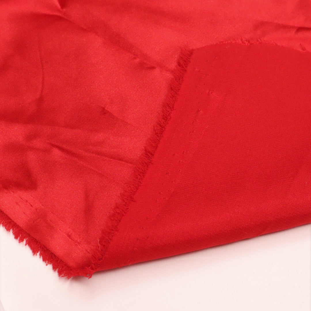 Wonder Woman Red - Polyester Satin Woven - Red - 1/2 Meter - FABCYCLE Deadstock and Sustainble Fabrics and Sewing Supplies (4634681737329)