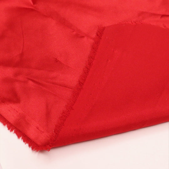 Wonder Woman Red - Polyester Satin Woven - Red - 1/2 Meter - FABCYCLE Deadstock and Sustainble Fabrics and Sewing Supplies (4634681737329)