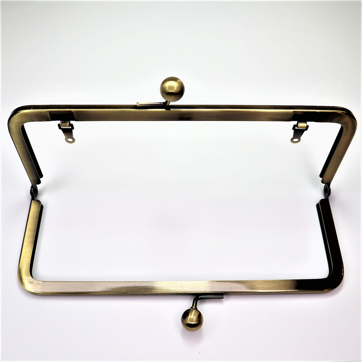 Metal Purse Frame - Small Half Rectangle - Brass - FABCYCLE Deadstock and Sustainble Fabrics and Sewing Supplies (6584107827313)