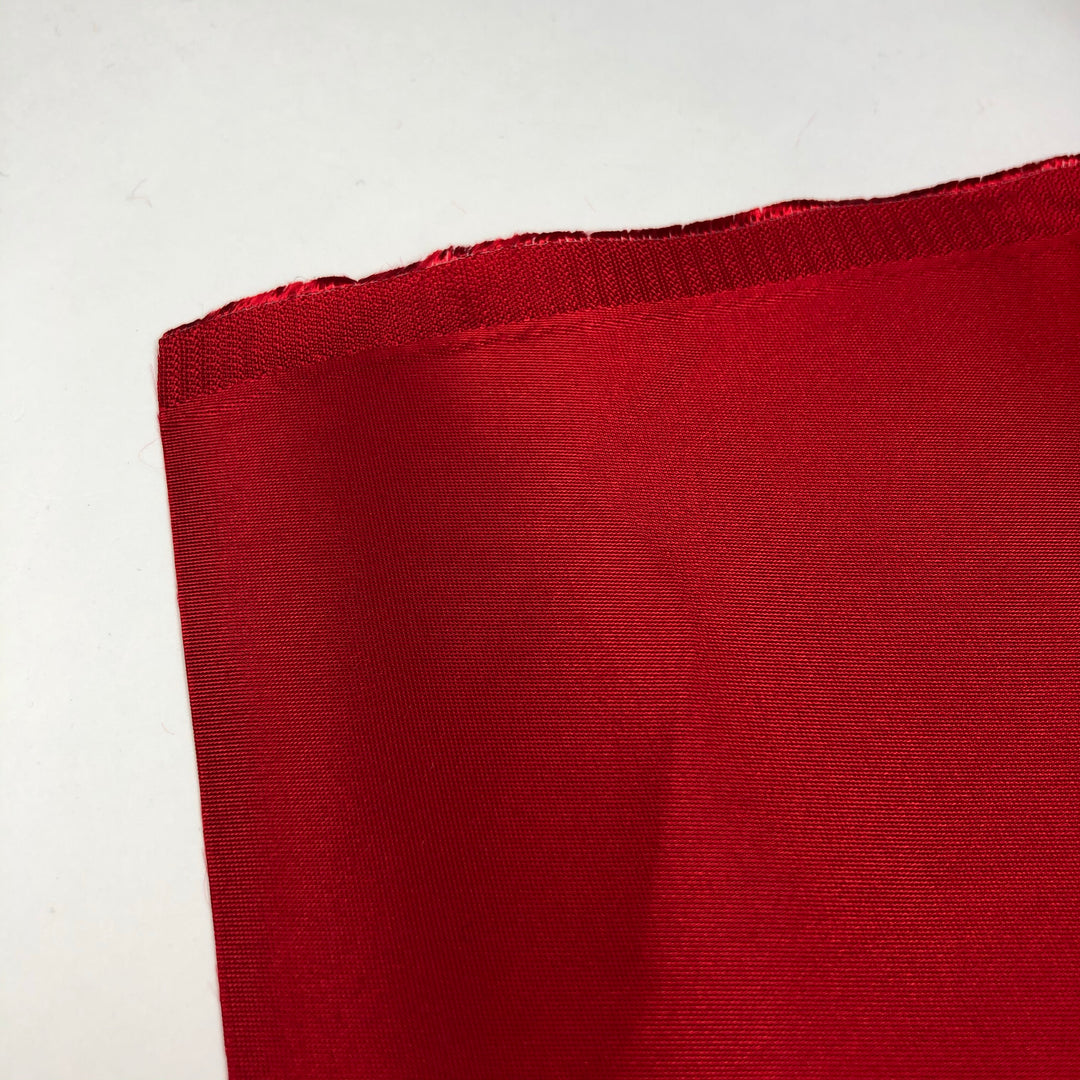 Cranberry - Polyester Satin Woven w/ Wax Backing - Red - 1/2 Meter - FABCYCLE Deadstock and Sustainble Fabrics and Sewing Supplies (4631726227569)